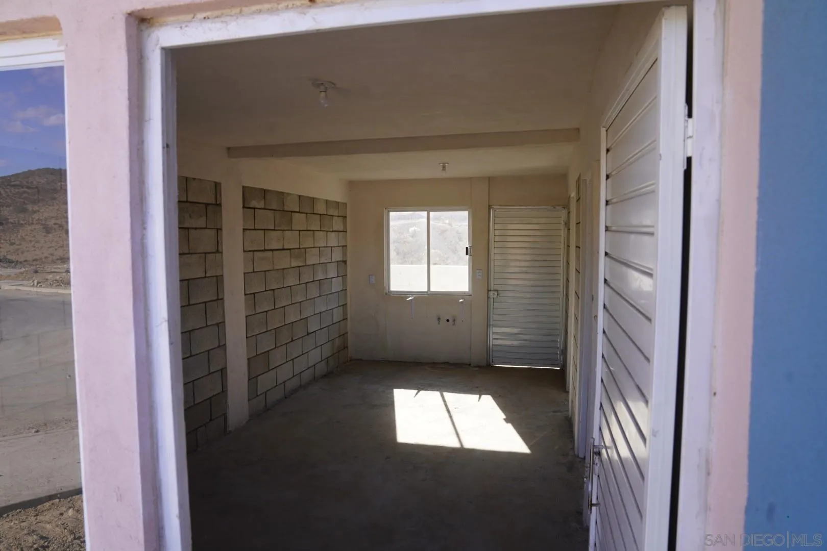 23 Blvd. Prieto Azabache Tijuana, B.C. 99999 - Photo 23 of 34 a view of a hallway with a window