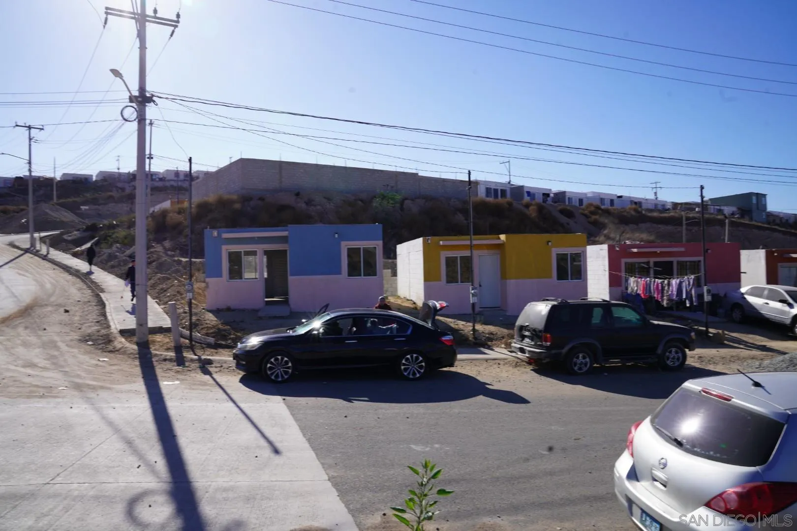 23 Blvd. Prieto Azabache Tijuana, B.C. 99999 - Photo 4 of 34 a car parked in front of a house