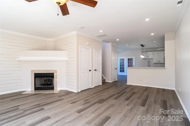 wooden floor in an empty room with a fireplace