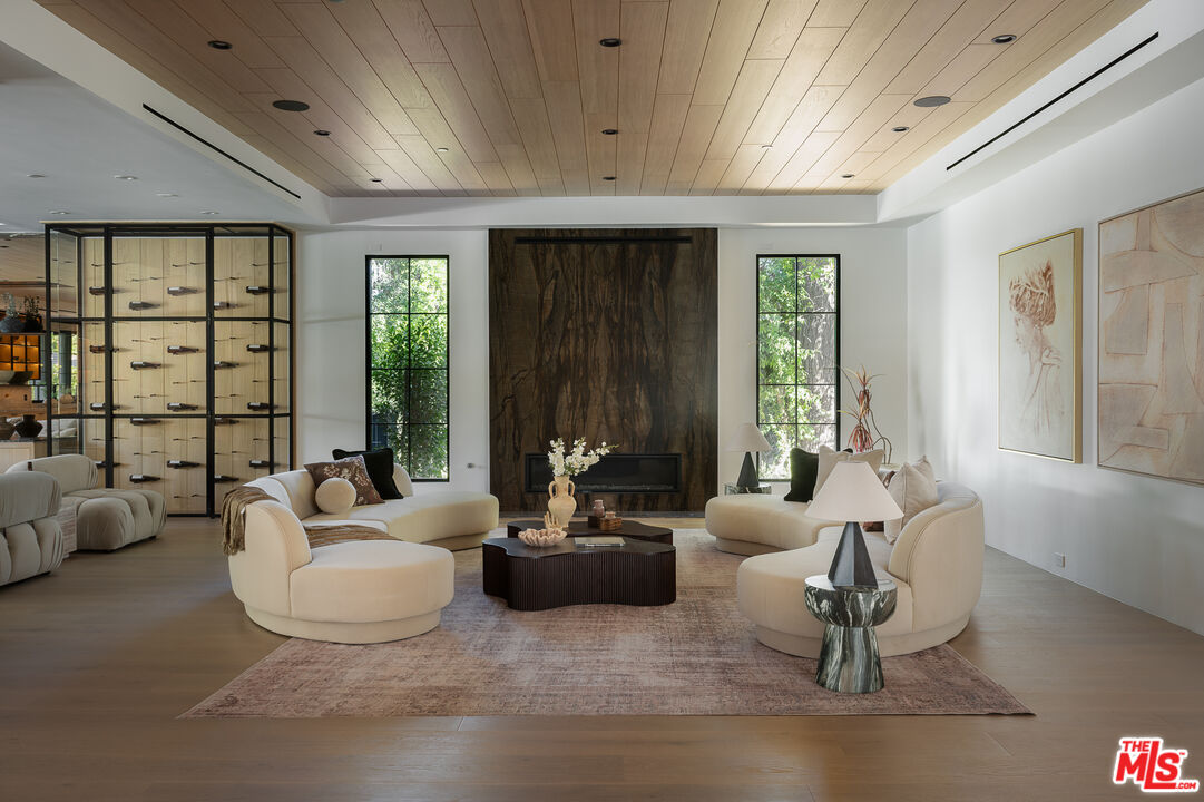 23615 Long Valley Road Hidden Hills, CA 91302 - Photo 16 of 75 a living room with furniture and a large window