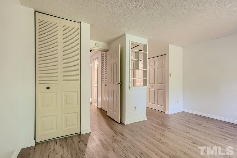 7702 Ohmann Court Raleigh, NC 27615 - Photo 16 of 28 a view of a bathroom with wooden floor