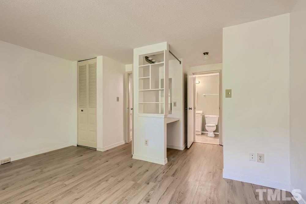 7702 Ohmann Court Raleigh, NC 27615 - Photo 17 of 28 wooden floor in an empty room