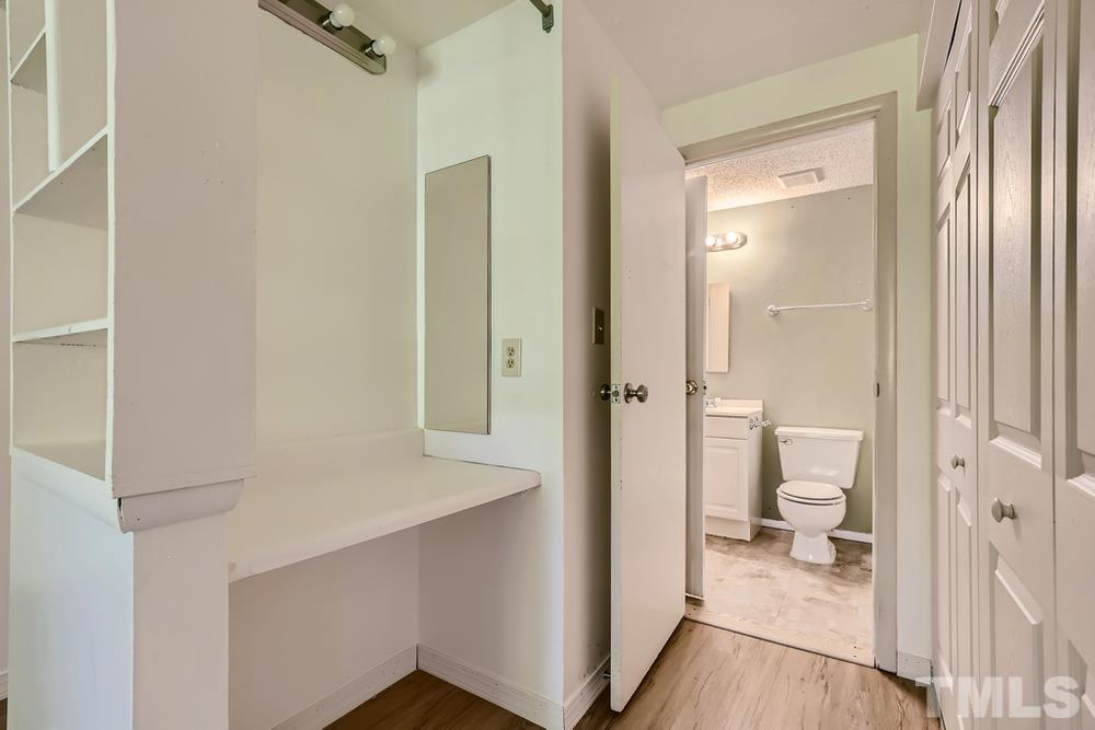 7702 Ohmann Court Raleigh, NC 27615 - Photo 19 of 28 a bathroom with a sink and a toilet