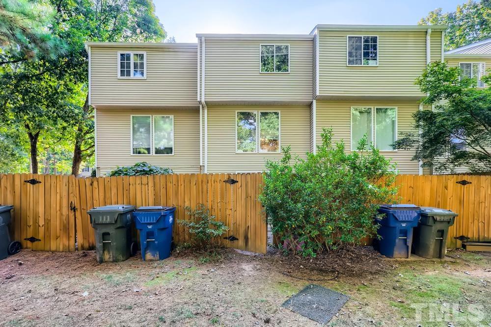 7702 Ohmann Court Raleigh, NC 27615 - Photo 28 of 28 a view of a backyard with plants and large tree