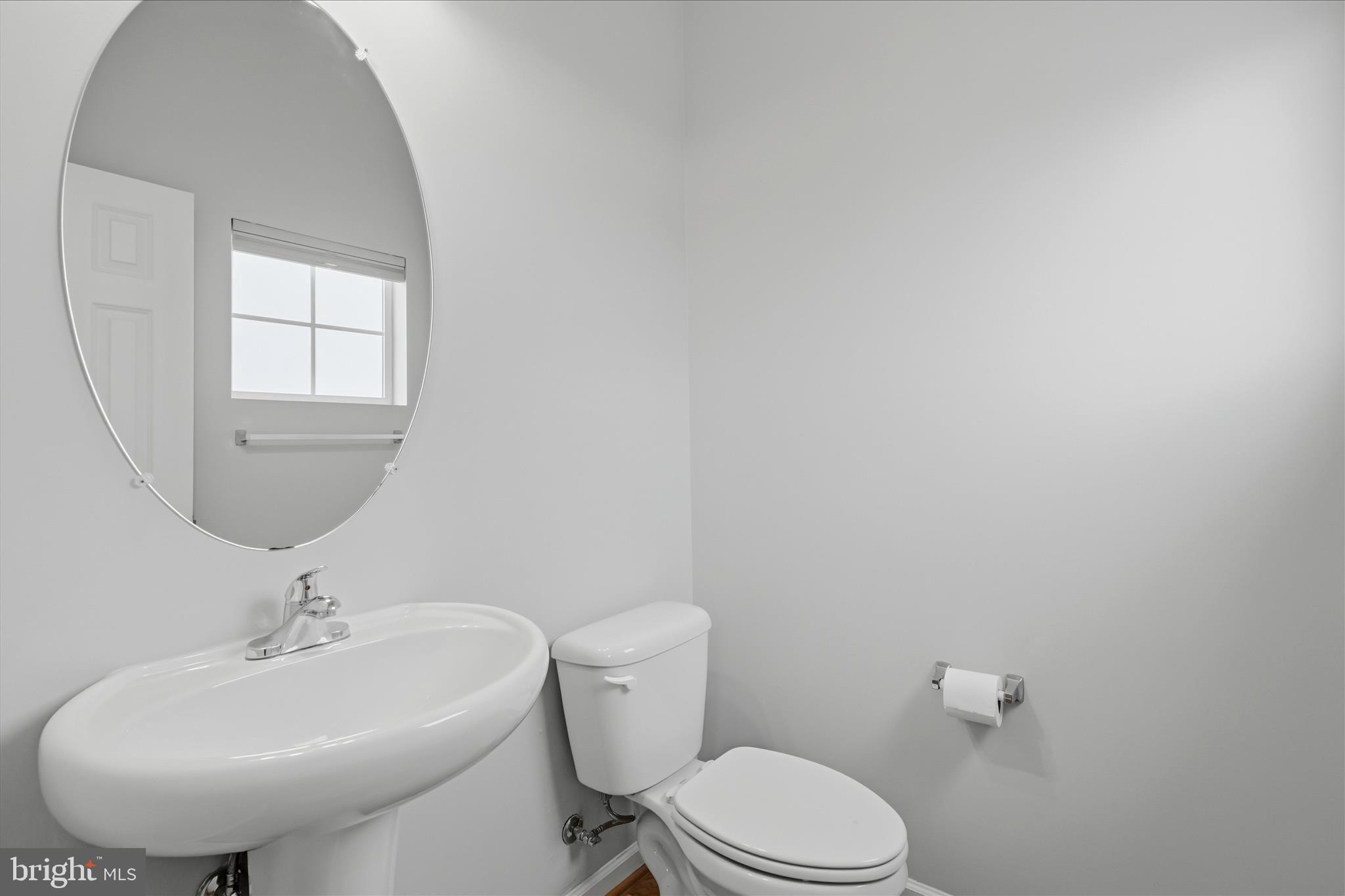 151 Brasstown Loop Stephenson, VA 22656 - Photo 26 of 88 a bathroom with a toilet a sink and mirror