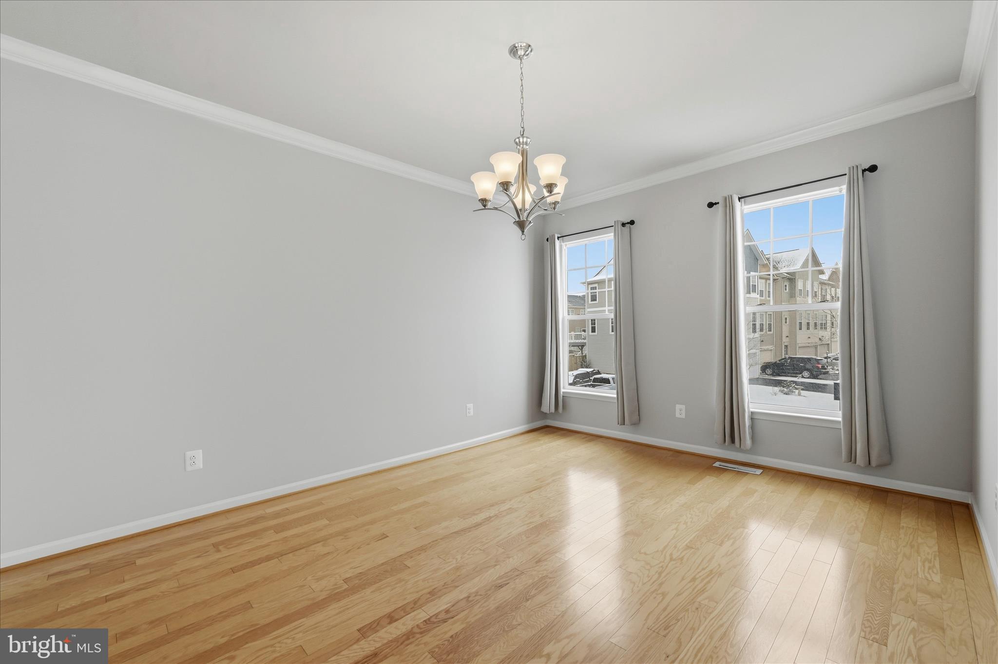 151 Brasstown Loop Stephenson, VA 22656 - Photo 28 of 88 a view of an empty room with wooden floor and a window