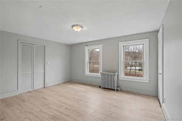 a view of a livingroom with a ceiling fan and window