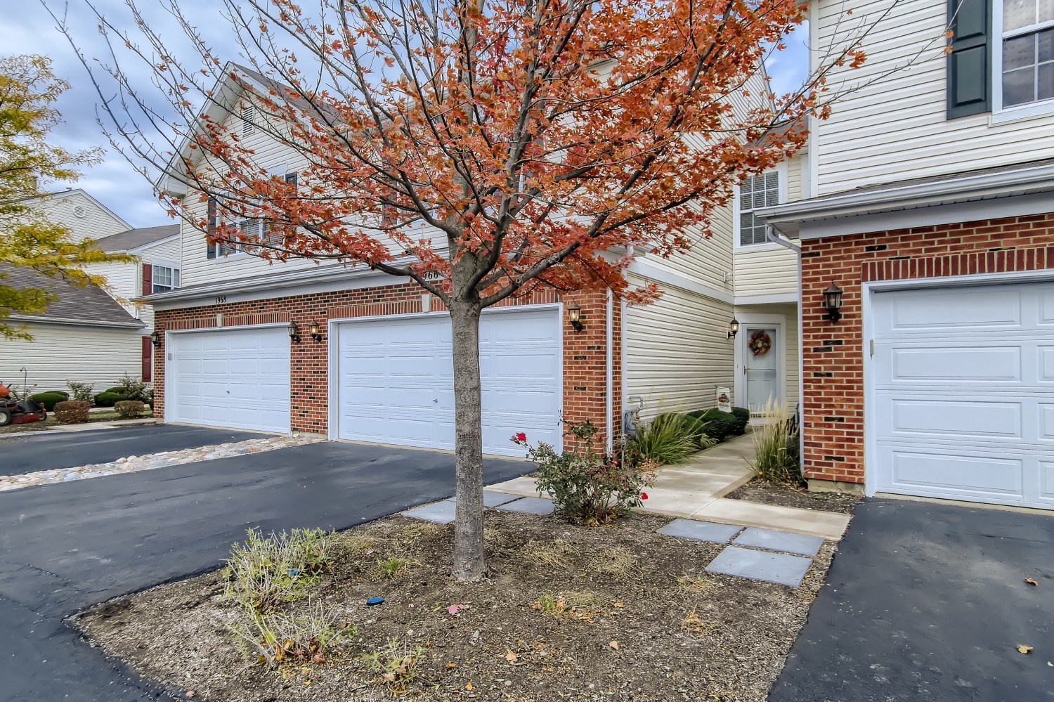 1966 West Cobblestone Road Romeoville, IL 60446 - Photo 2 of 31 a front view of a house with garden