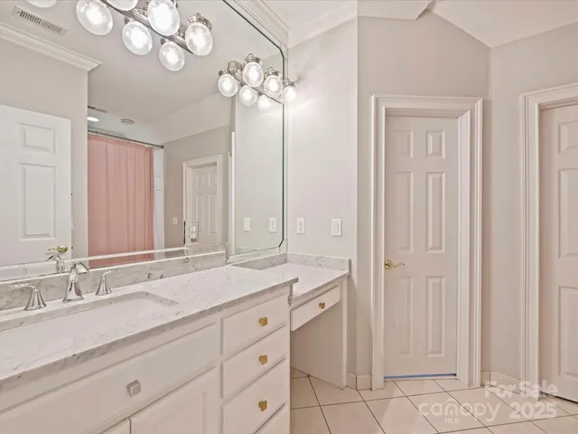 a bathroom with a sink double vanity and a mirror
