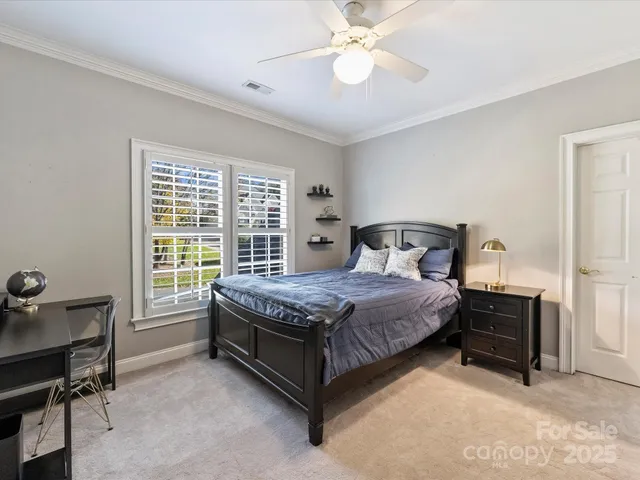 a bedroom with a bed and a table in it