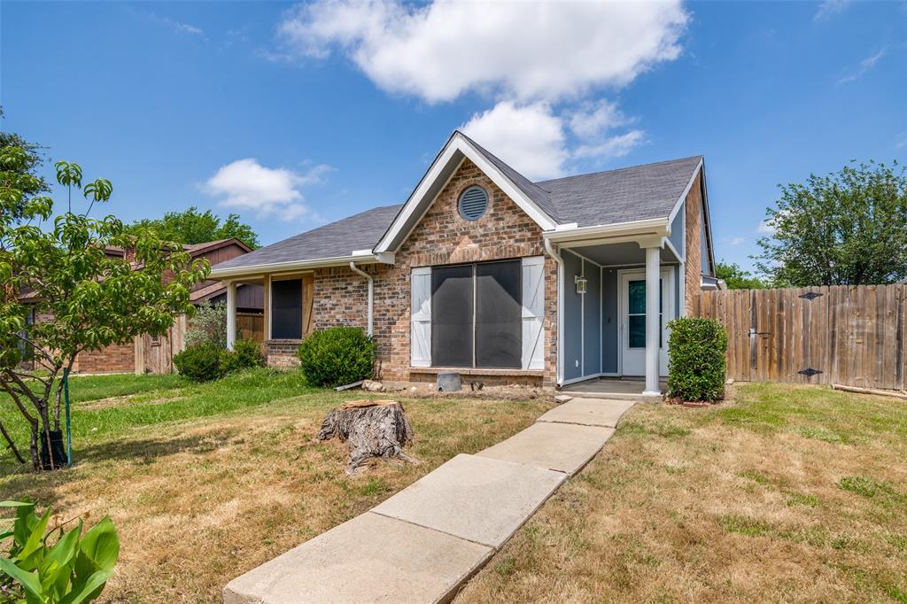 4430 Chapman Street The Colony, TX 75056 - Photo 1 of 24 a front view of house with yard and green space