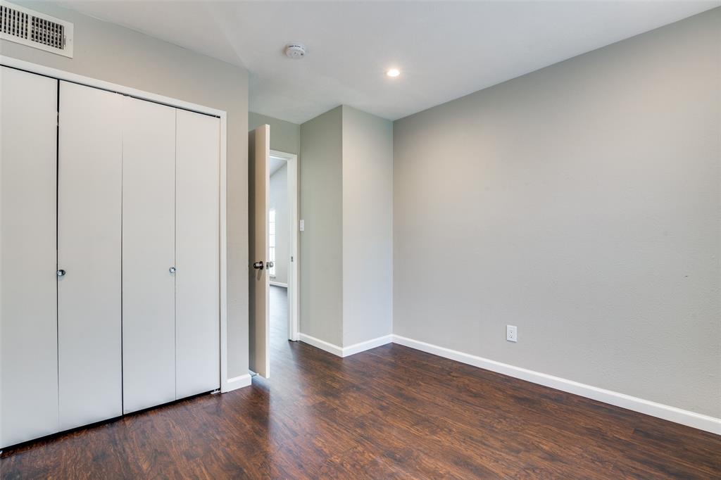 4430 Chapman Street The Colony, TX 75056 - Photo 20 of 24 a view of an empty room with wooden floor