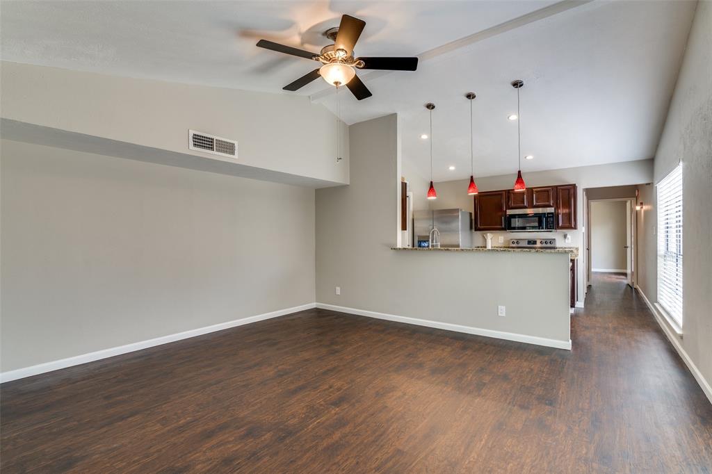 4430 Chapman Street The Colony, TX 75056 - Photo 6 of 24 a view of kitchen with cabinets and wooden floor
