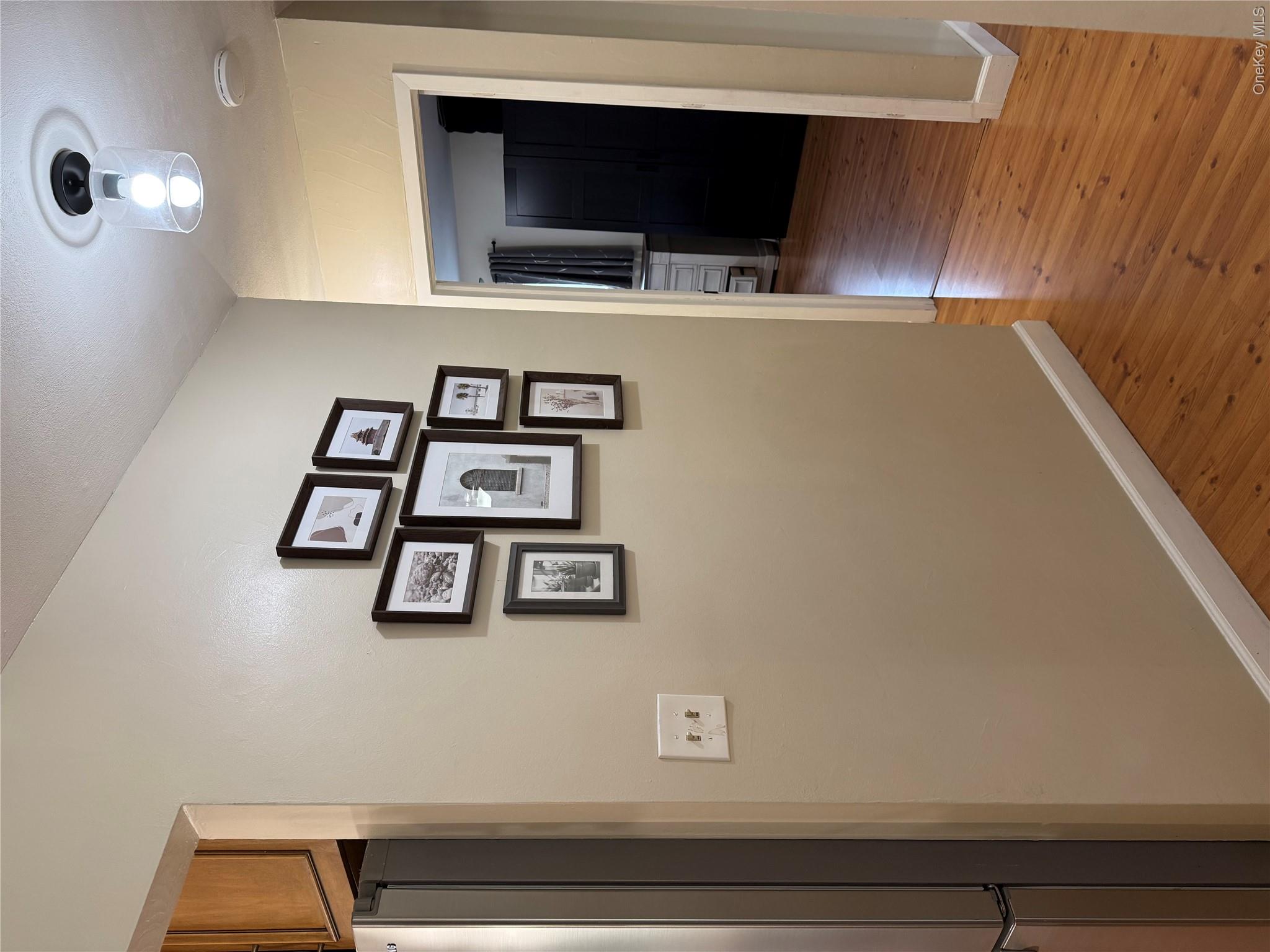 161 Hawkins Road Centereach, NY 11720 - Photo 9 of 16 a view of a hallway with wooden floor and closet