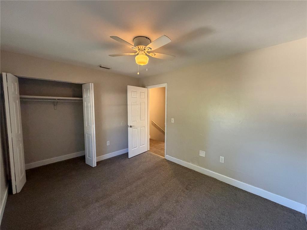 1718 Southwest 69th Terrace, Unit A Gainesville, FL 32607 - Photo 5 of 6 a view of an empty room with a window