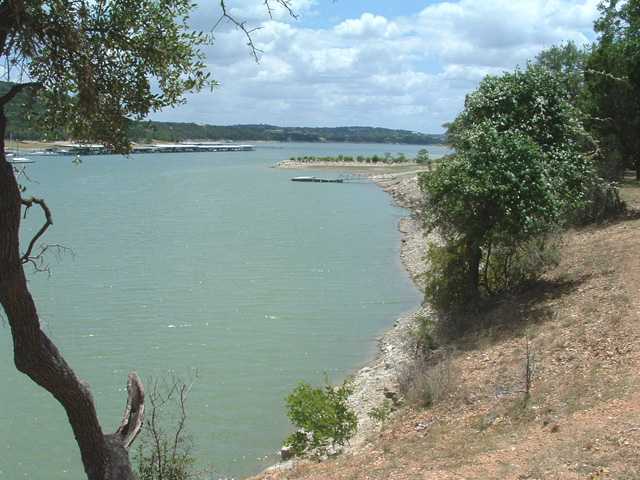 a view of a lake from a yard