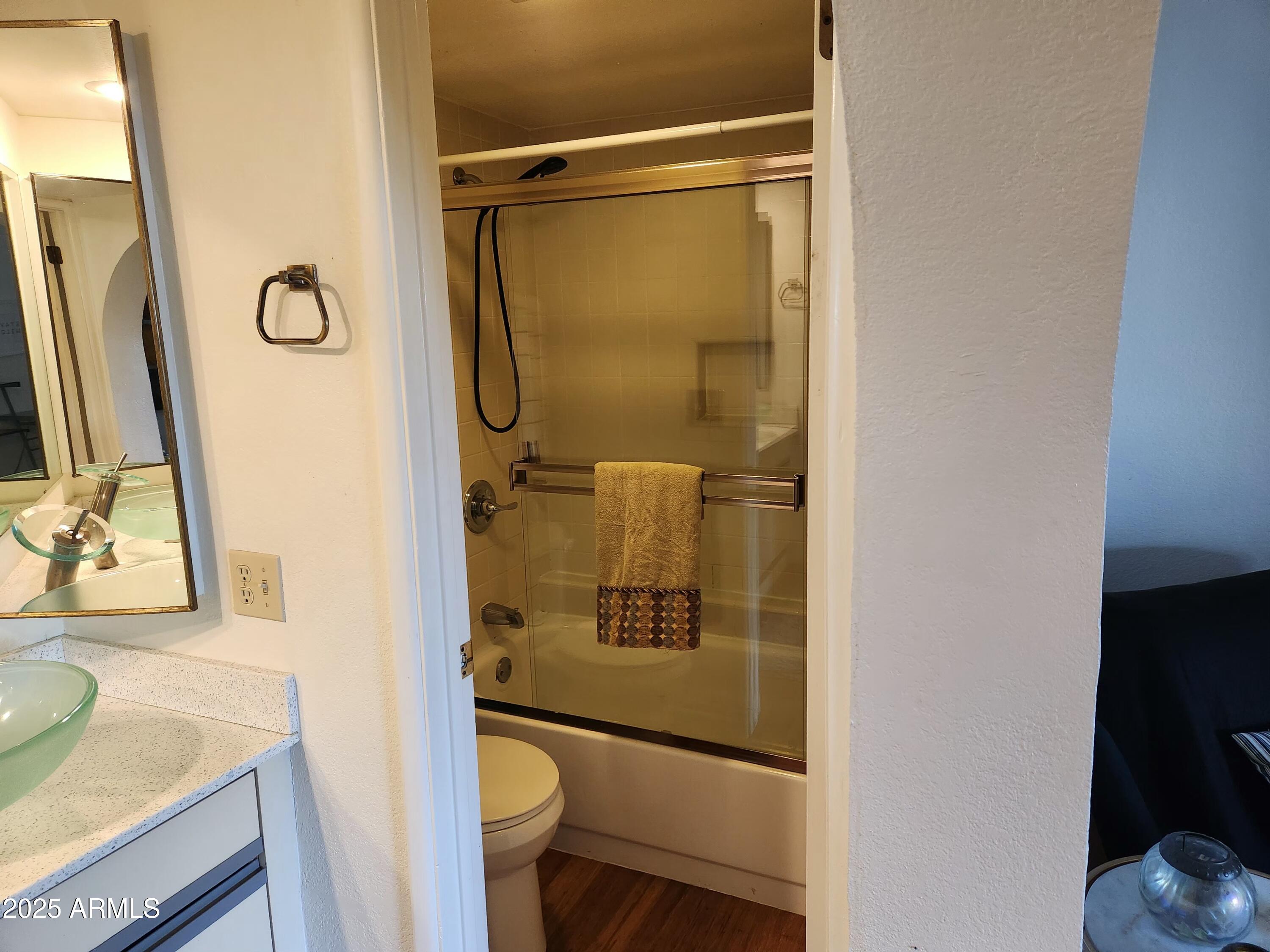 7557 North Dreamy Draw Drive, Unit 184 Phoenix, AZ 85020 - Photo 13 of 28 a bathroom with a granite countertop sink toilet and shower