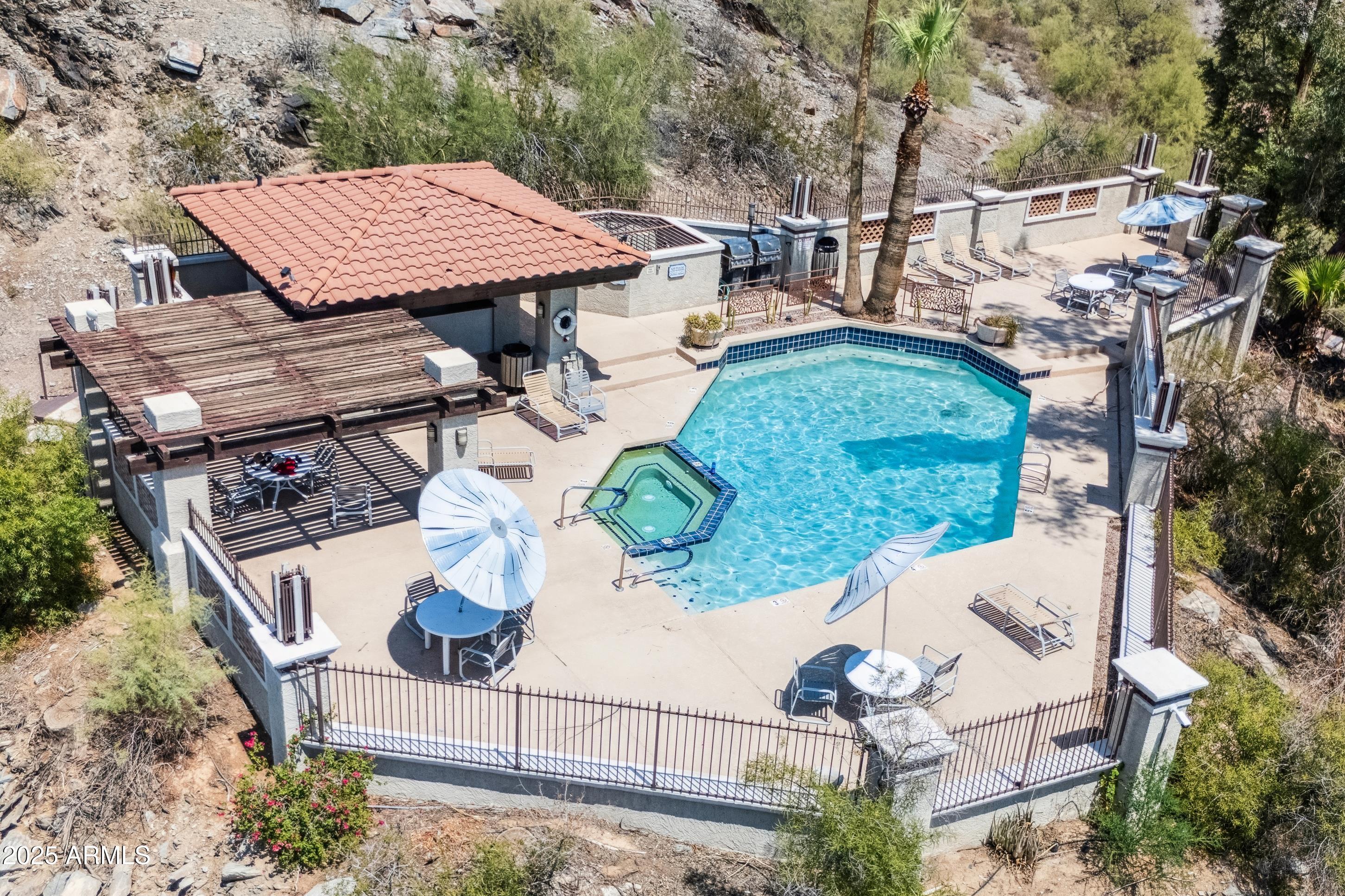 7557 North Dreamy Draw Drive, Unit 184 Phoenix, AZ 85020 - Photo 28 of 28 an aerial view of a house with garden space and sitting area
