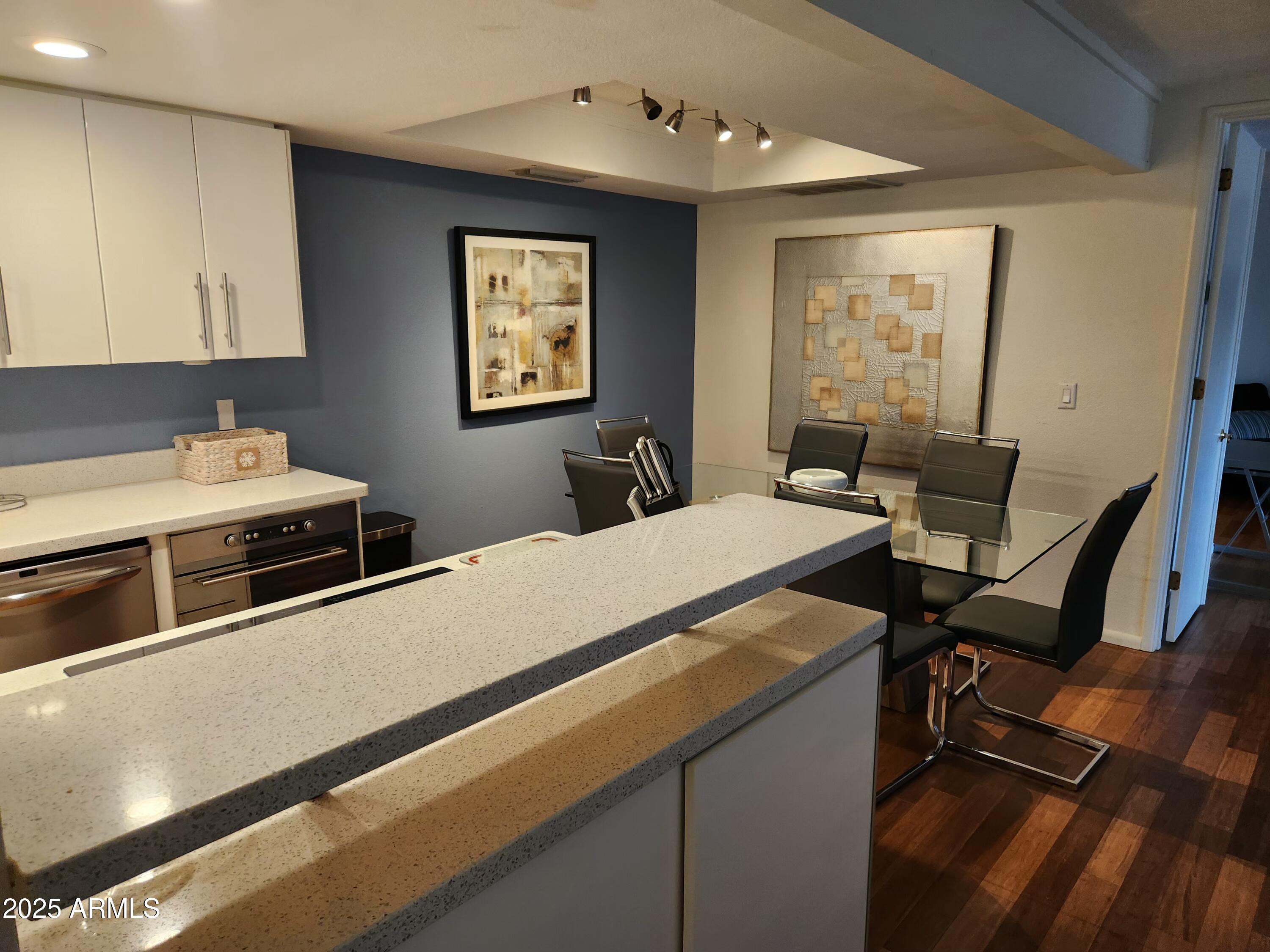 7557 North Dreamy Draw Drive, Unit 184 Phoenix, AZ 85020 - Photo 4 of 28 a room with a bed and a table