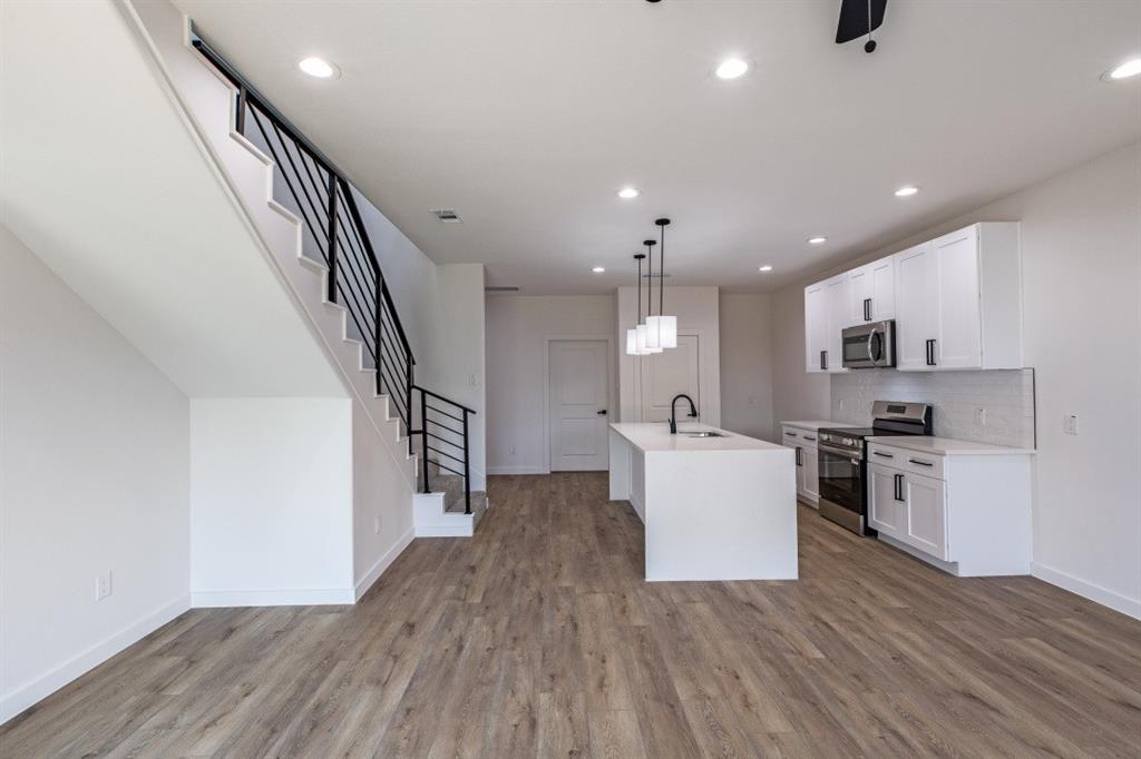 2427 Merlin Street Dallas, TX 75215 - Photo 12 of 24 a view of kitchen and wooden floor