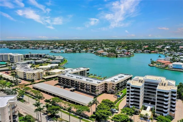 an aerial view of a house with a lake view