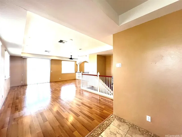a view of a living room with a wooden floor