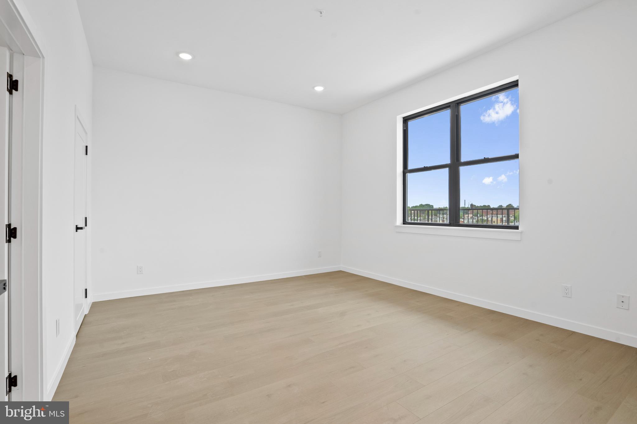 3211 Cedar Street, Unit 306 Philadelphia, PA 19134 - Photo 9 of 18 an empty room with a window