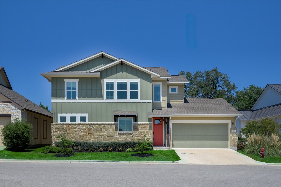 142 Volterra Lane Dripping Springs, TX 78620 - Photo 1 of 37 a front view of a house with a yard and garage