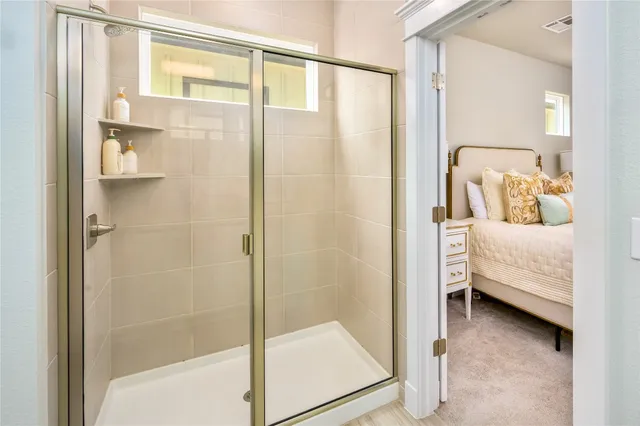 a bathroom with a tub and shower