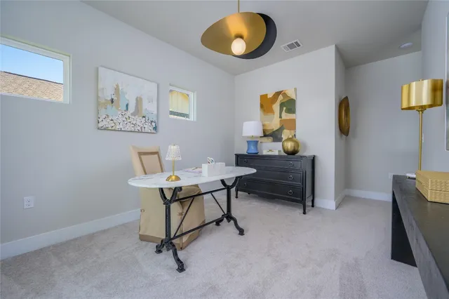 a workspace with furniture and window