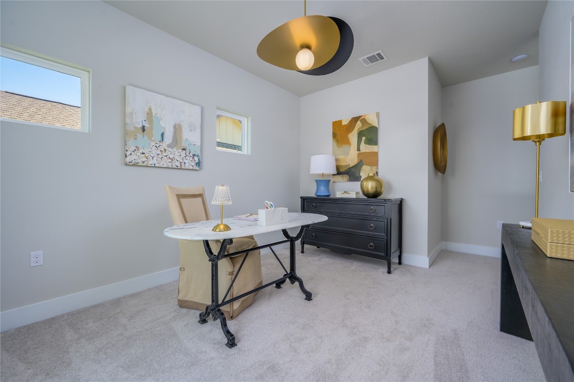 142 Volterra Lane Dripping Springs, TX 78620 - Photo 14 of 37 a workspace with furniture and window