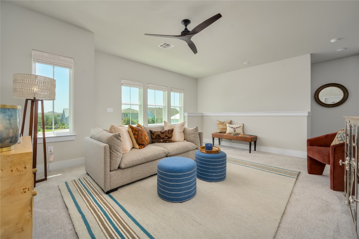142 Volterra Lane Dripping Springs, TX 78620 - Photo 17 of 37 a living room with furniture
