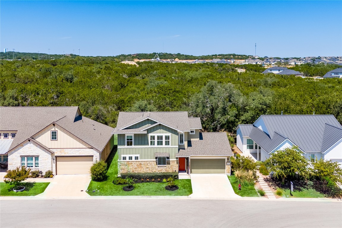 142 Volterra Lane Dripping Springs, TX 78620 - Photo 22 of 37 an aerial view of residential houses with outdoor space and trees