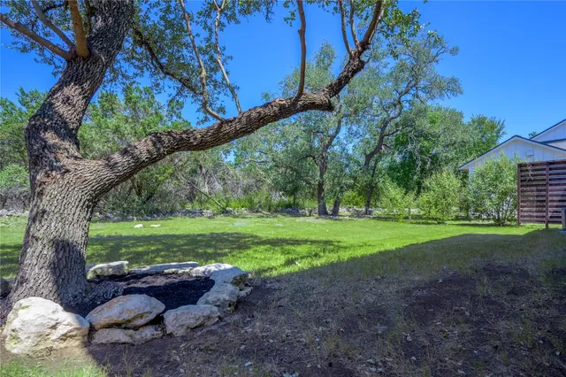 a view of a yard with a tree