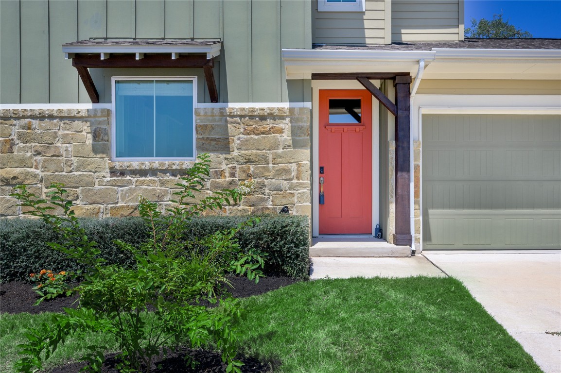 142 Volterra Lane Dripping Springs, TX 78620 - Photo 29 of 37 a front view of a house with garden