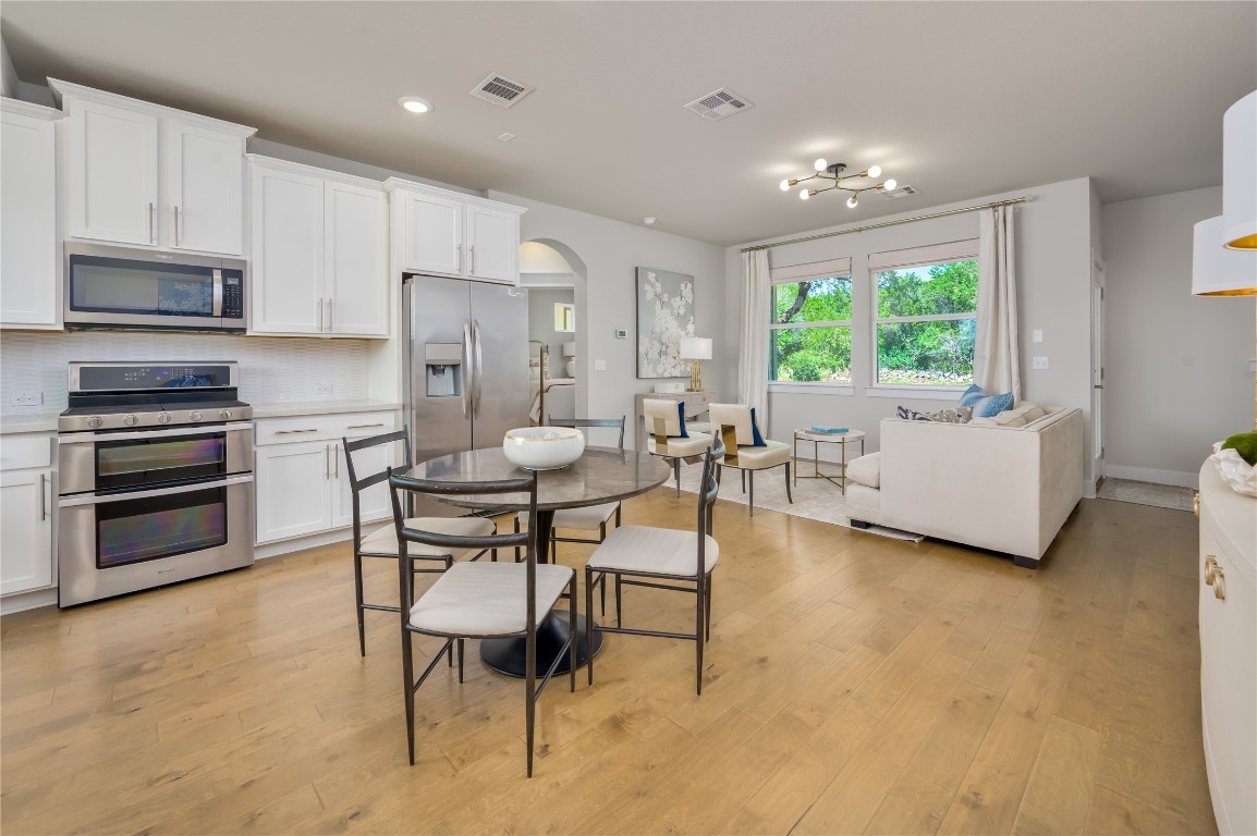 142 Volterra Lane Dripping Springs, TX 78620 - Photo 3 of 37 a living room with furniture and a large window