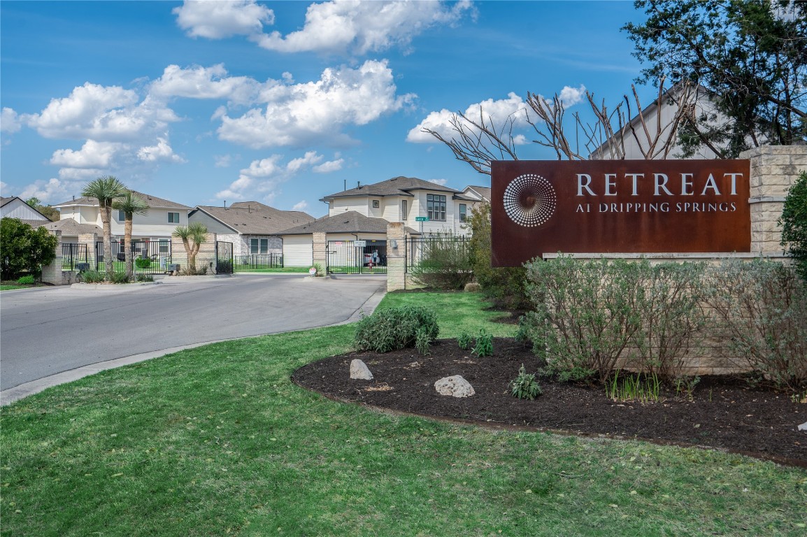 142 Volterra Lane Dripping Springs, TX 78620 - Photo 33 of 37 a view of a street with a building in the background
