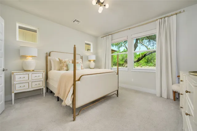 a bed room with a bed and a window