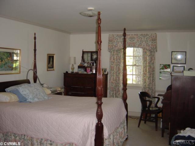301 Ralston Road Henrico, VA 23229 - Photo 6 of 9 a bedroom with a bed window and chair