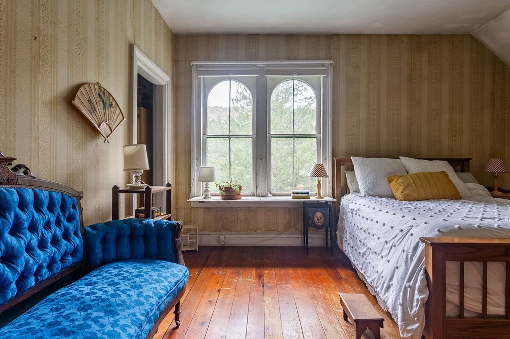 67 Fisk Road Bovina, NY 13753 - Photo 29 of 48 Classic wide plank wood flooring anchors this character-filled upper level bedroom.