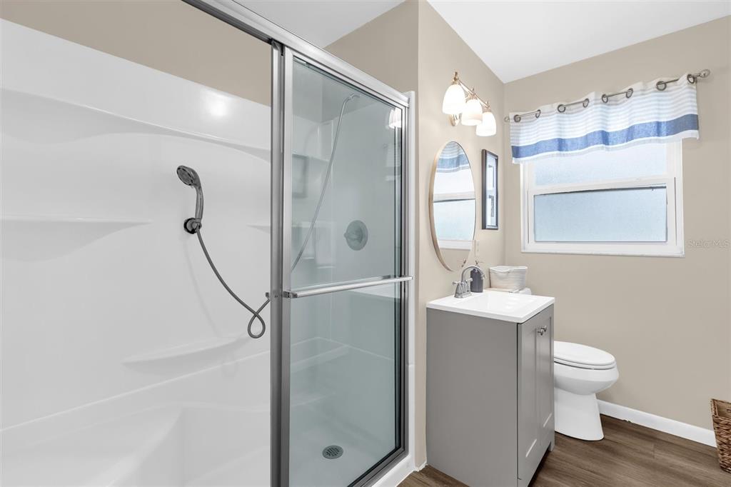 106 Oak Street Altamonte Springs, FL 32714 - Photo 16 of 30 a bathroom with a bathtub shower sink vanity and toilet