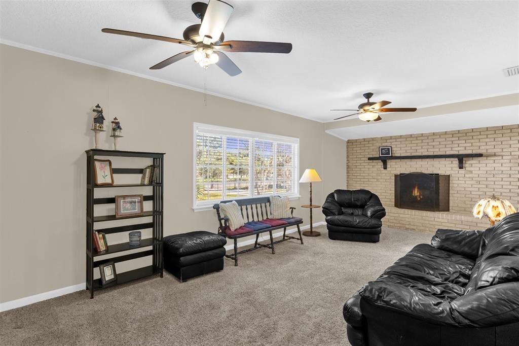 106 Oak Street Altamonte Springs, FL 32714 - Photo 3 of 30 a living room with furniture and a fireplace