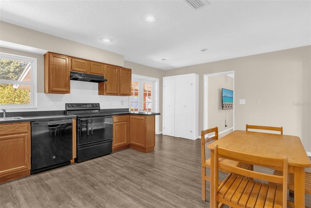 106 Oak Street Altamonte Springs, FL 32714 - Photo 7 of 30 a kitchen with stainless steel appliances granite countertop a stove and a refrigerator