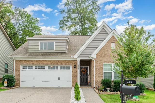 a view of house with yard