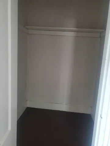 a view of a bedroom with closet
