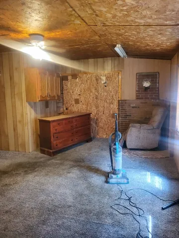 a kitchen with granite countertop a sink and a stove top oven