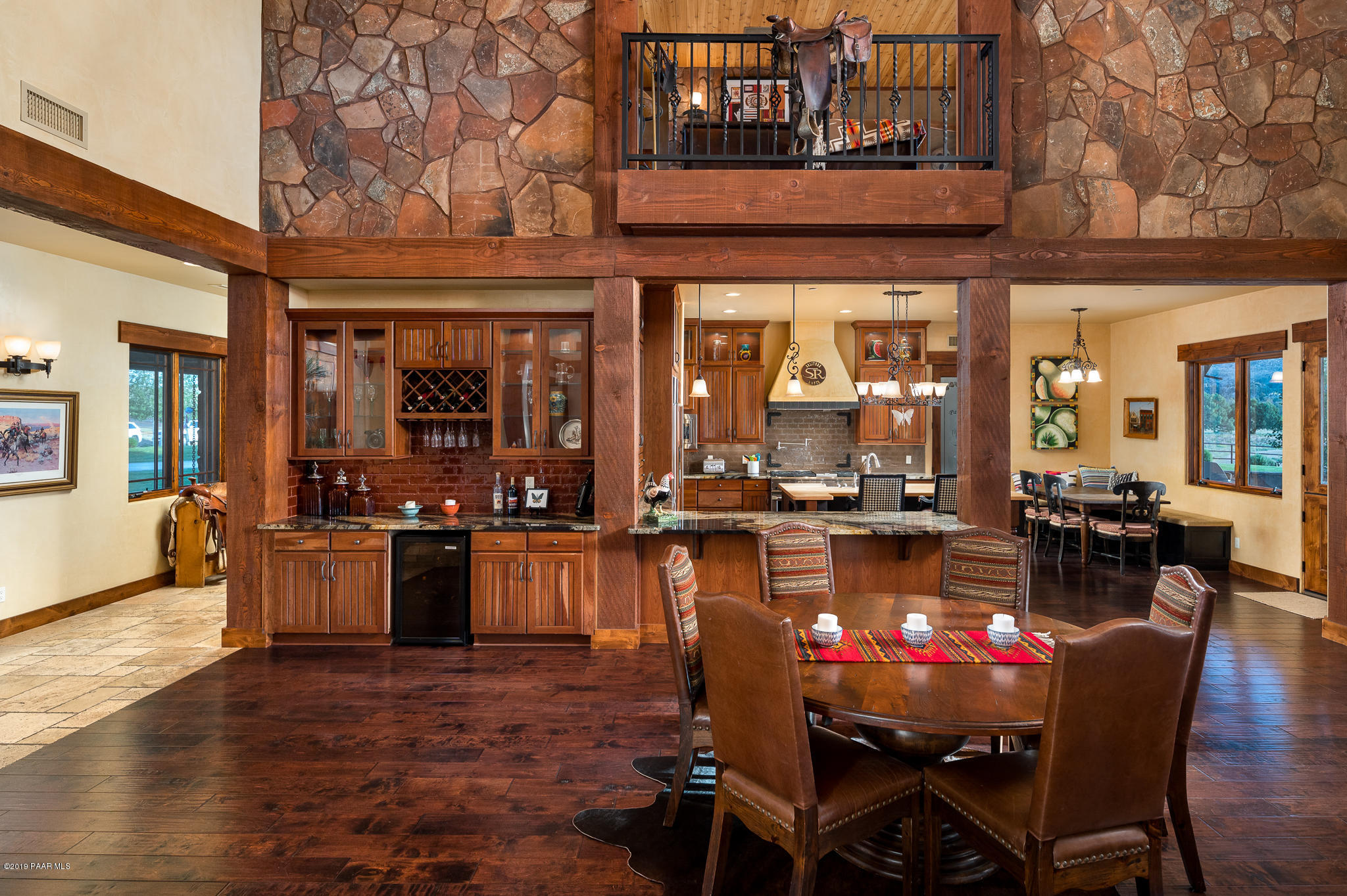 9120 North American Ranch Road Prescott, AZ 86305 - Photo 11 of 66 a view of a dining room with furniture window and wooden floor