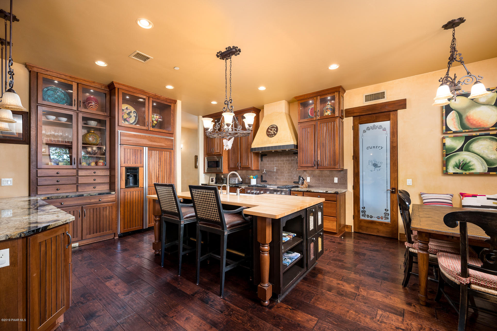 9120 North American Ranch Road Prescott, AZ 86305 - Photo 12 of 66 a large kitchen with a table and chairs