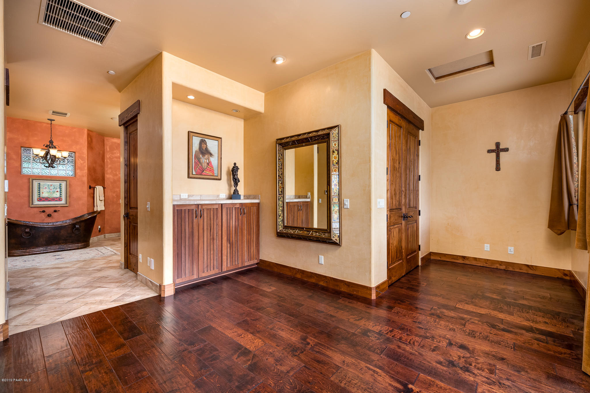 9120 North American Ranch Road Prescott, AZ 86305 - Photo 23 of 66 a view of a hallway with wooden floor and closet