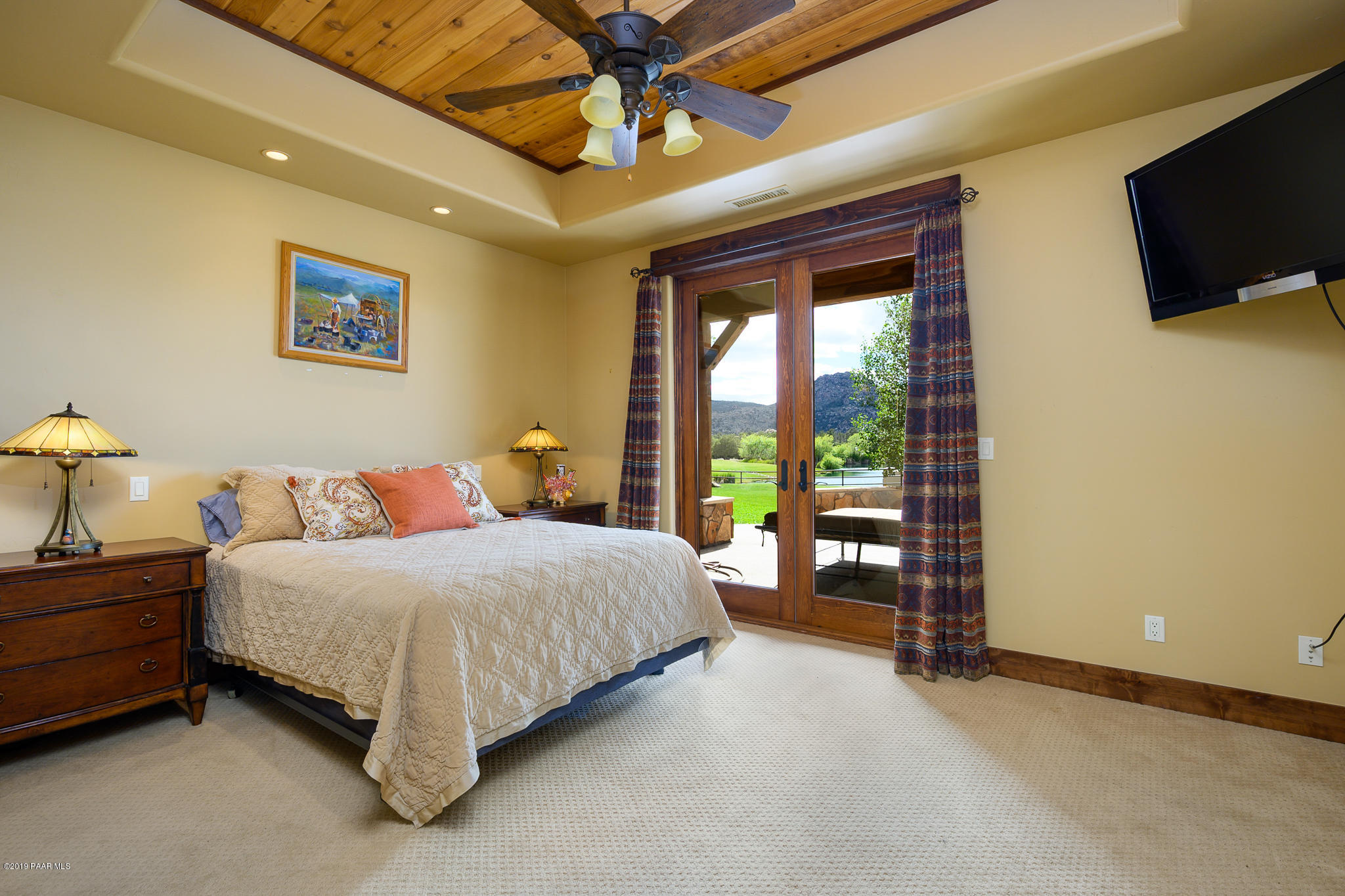 9120 North American Ranch Road Prescott, AZ 86305 - Photo 30 of 66 a bedroom with a bed and a tv on table